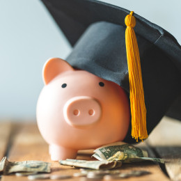 Piggy bank with graduation cap