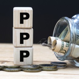 PPP loan blocks with jar of money